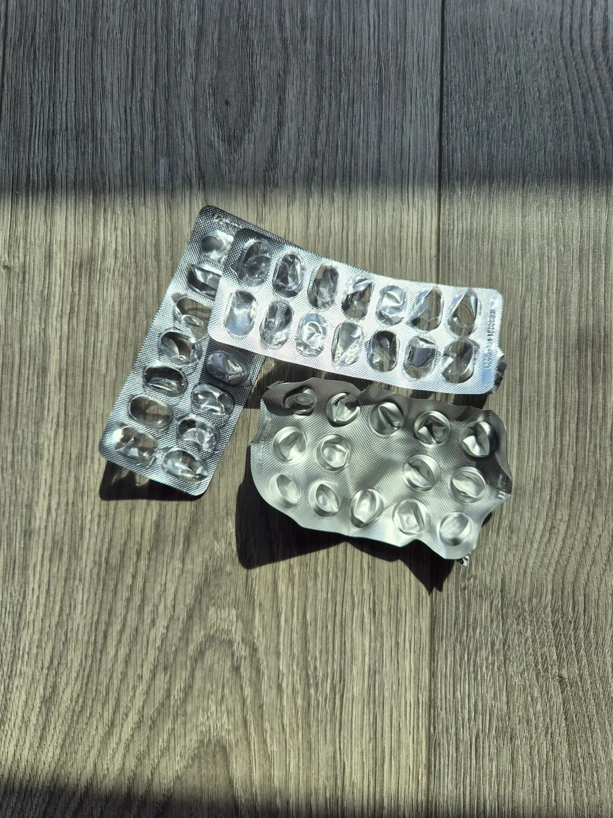 Two empty foil blister packs, popped and kept to drop at Boots for recycling.